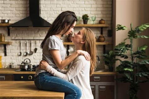 lesbian photoshoot|Beautiful lesbian girls making love in studio Stock Photo